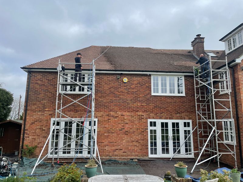 Roof cleaning carried out safely from scaffold towers by The Roof Moss Cleaners in Crowthorne